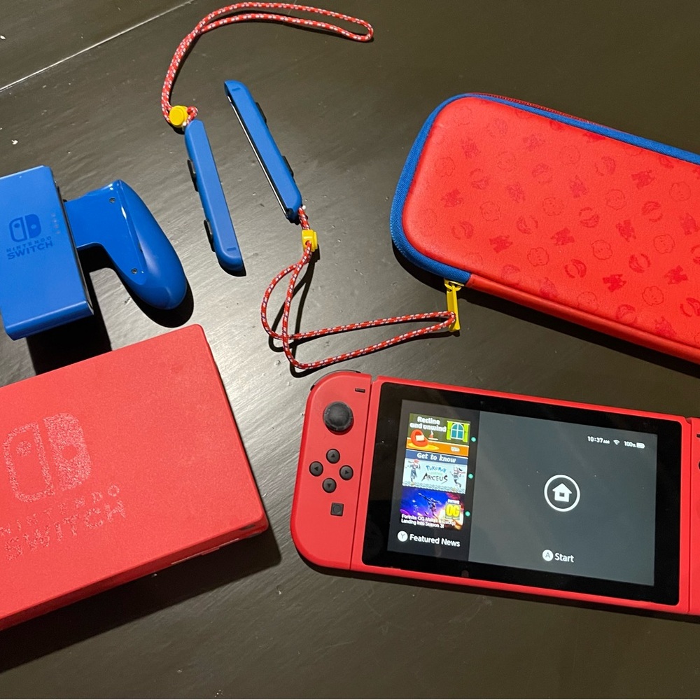 Nintendo Switch Console with Red and Blue Accessories